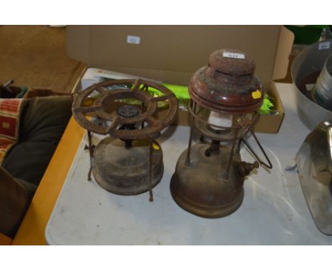 A Primus stove together with a small hurricane lamp