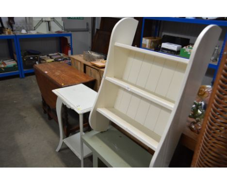 A white painted hanging shelf together with a two tier side table