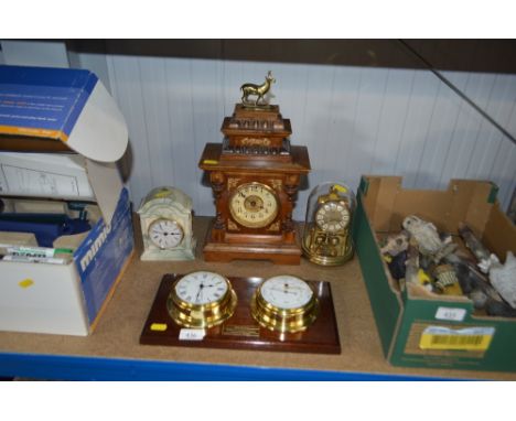 A clock and barometer together with a mantle clock; anniversary clock and one other mantle clock