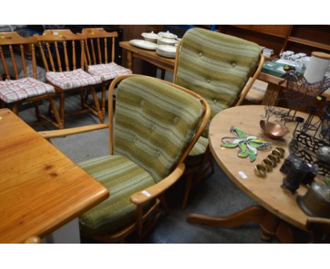 A near pair of Ercol armchairs