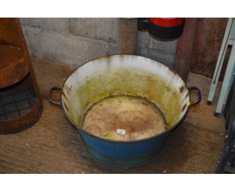 An enamel twin handled bath