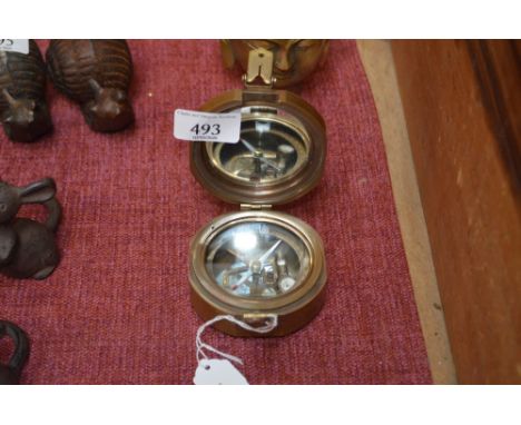 A reproduction brass cased compass (85)