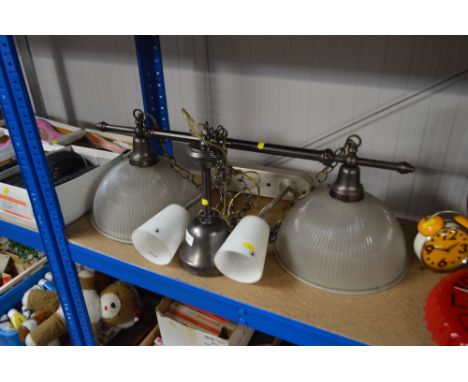 A metal light fitting and one other