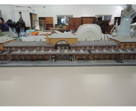 A 00 gauge kit built model of a continental train station, approx 30 inches 