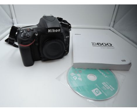 A Nikon D600 camera body in original box with manual and memory card