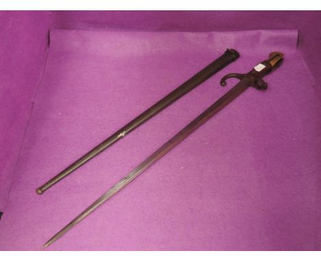 A French Gras rifle, model 1874 bayonet with scabbard, 1880 on edge of blade