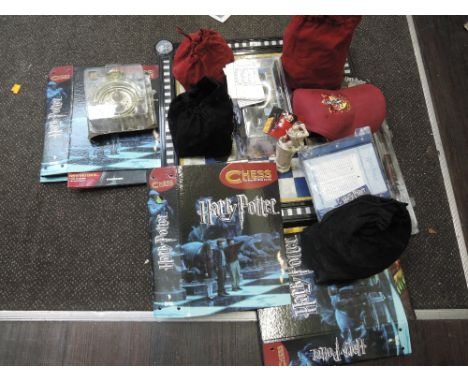 A DeAgostini Harry Potter Chess The Step by Step Course with accessories and many figures, along with similar merchandise inc