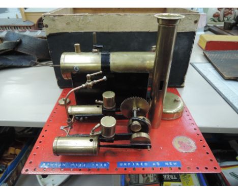 A 1930's Bowman live steam plant having twin piston engine and brass boiler, appears unfired, with box