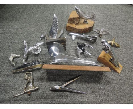 A selection of vintage Motor car and engine hood ornaments and decals including Art Deco and Bauhaus design, Jaguar, nude fem
