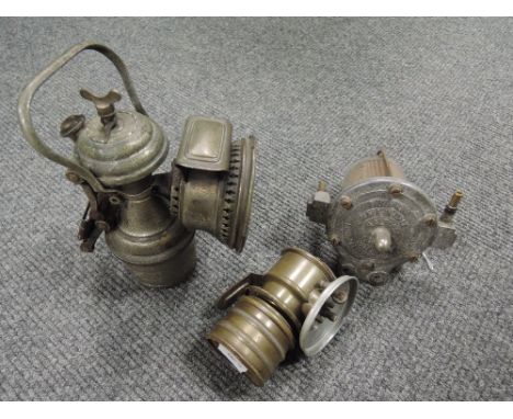 A selection of vintage motor car or cycle carbide lamps and light