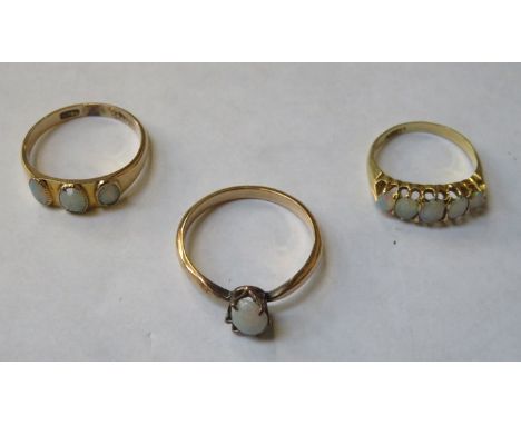 THREE VARIOUS OPAL SET DRESS RINGS