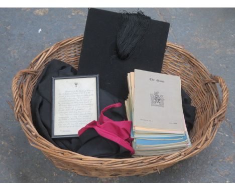 WICKER BASKET CONTAINING VINTAGE GRADUATION GOWN, MORTAR BOARD PLUS VARIOUS HIGH SCHOOL MAGAZINES