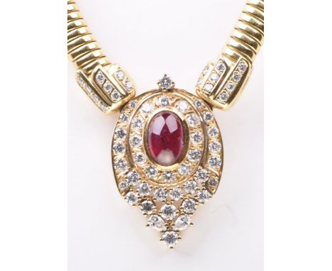 A ruby and diamond set pendant neckletThe centrally set oval cabochon ruby, to a double round brilliant-cut diamond cluster l