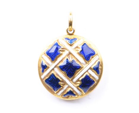 A Victorian enamel sentimental pendant locketThe white and blue enamel lattice design to unmarked yellow metal, with a glazed