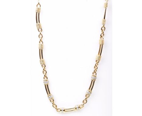 An 18ct gold and diamond set necklaceThe open work curved baton links, with round brilliant-cut diamond set twist detail, to 