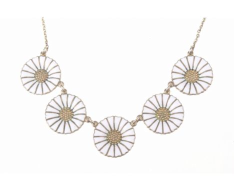 Georg Jensen: A silver gilt and enamel daisy necklaceThe five daisy links with white enamel detail, to a trace-link chain, si