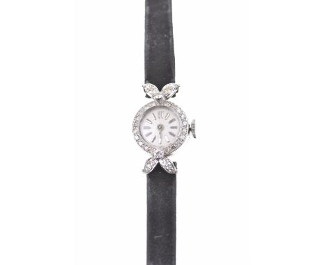 An 18ct white gold diamond set lady's cocktail watchThe silvered dial with hourly applied gilt markers, circular shaped case 