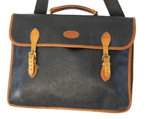 Mulberry: A vintage blue Scotch grain and tan leather briefcaseDesigned with a textured navy blue leather exterior and tan le