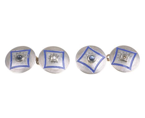 A pair of enamel, diamond and sapphire cufflinks Each circular plaque set with a round old-cut diamond or a cabochon sapphire