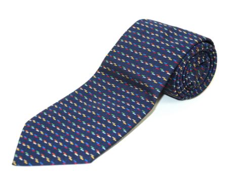 An Hermes silk tieOf typical form, with woven multicoloured linear design against a ribbed navy blue ground, length 145cm