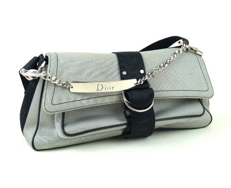 Christian Dior: A silver satin handbagThe silver satin, with black satin 'Dior' handles and trims as well as a curb-link meta