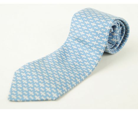 An Hermes silk tieThe very pale blue ground, with a dark blue repeating 'H' pattern, length 146cm