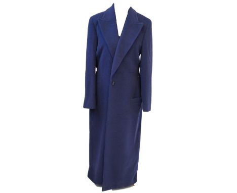 Gianni Versace: A ladies coatThe long navy blue coat, a mix of wool, angora and cashmere, with one button, and two external p