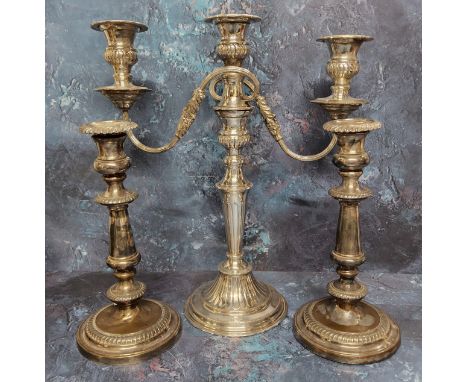 An E.P.N.S.&nbsp; two-branch, three light candelabra, 38cm high; a a pair of EP on Copper table candlestick, 26cm high, early