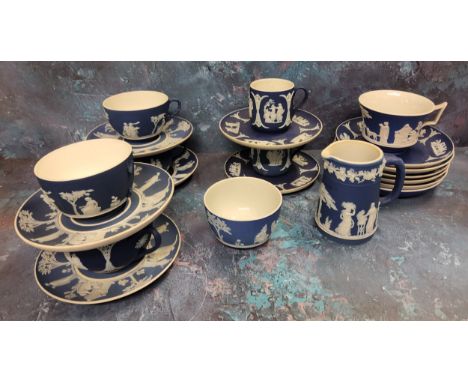A Wedgwood blue Jasperware teacup and saucer, typically sprigged in white, impressed mark, early 20th century;&nbsp; others;&