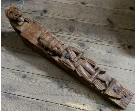 An early Colonial hardwood caryatid carved wall bracket in the form of a warrior bearing rifle, with iron fixtures, surmounte