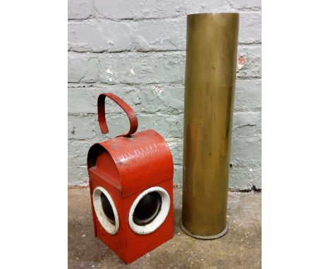 A Kenyon's Kenlite road lamp, red painted;&nbsp; a large shell case (2) 