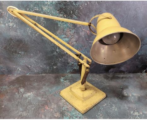 A Herbert Terry Anglepoise lamp - an early example finished in cream, weighted plinth base. 