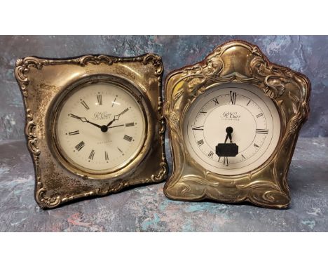 A silver mounted Art Nouveau style clock, silver panel embossed in relief with poppies, a vacant panel to rear, wood backed, 