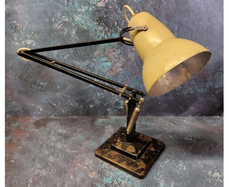 A Herbert Terry Anglepoise lamp - an early example finished in cream and black, weighted plinth base. 