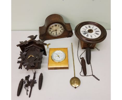 A German wall clock, Roman numerals, striking on bell, c.1890;&nbsp; an early 20th cuckcoo clock;&nbsp; a mantel clock, c.193