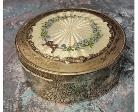 A silver circular jewellery trinket box, the hinged cover decorated with a central white guilloche enamel panel, hand painted