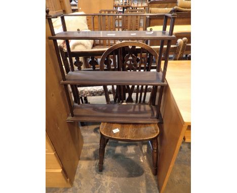 Wall hanging shelf unit and a wheelback chair 
