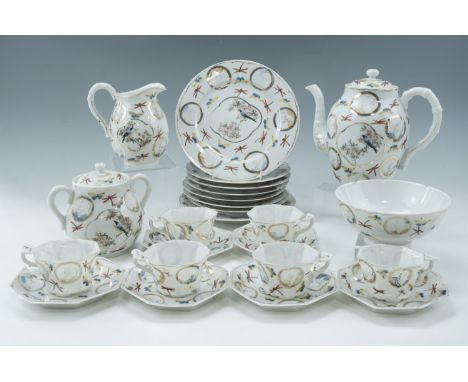 An early 20th Century Japanese porcelain tea set, the cups of polygonal section and having Ruyi form handles