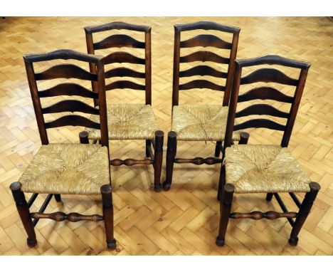 Four late 19th / early 20th Century rush-seated ladder-back chairs