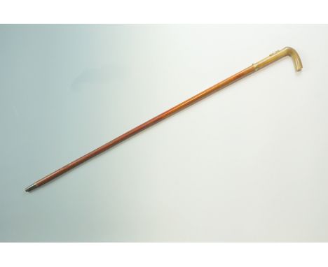 A Victorian sword stick, having a horn handle with gilt metal collar incorporating a scabbard catch release stud, an etched t