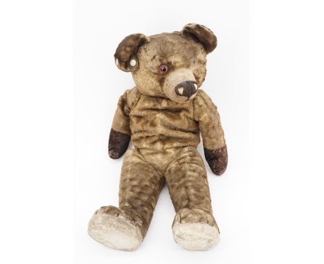 An early Chad Valley Teddy bear, having a growler and a glass eye, 50 cm (a/f)