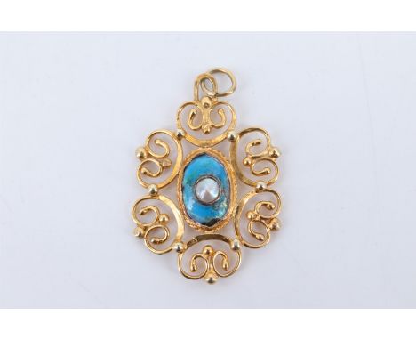 An artisan-made openwork yellow metal pendant, comprising a central oval blue iridescent enamel plaque centred by a mabe pear