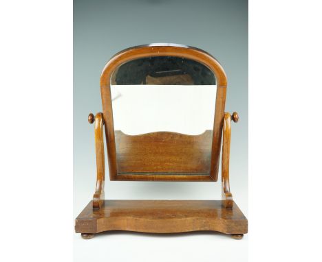 A Victorian mahogany serpentine-fronted swivel toilet mirror, 60 cm high