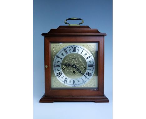 A contemporary Rapport mahogany mantle clock, 25 cm x 13 cm x 32 cm