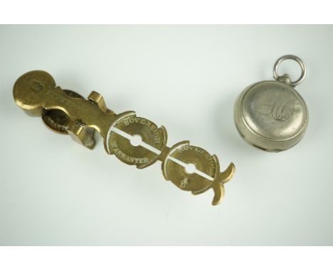 A late 19th / early 20th Century watch chain fob sovereign case, its interior decorated in depiction of a lucky horseshoe, to