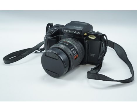 A Pentax SFX SLR camera with SMC Pentax-F zoom lens