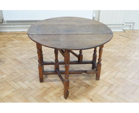 A late 18th / early 19th Century joined oak gate-leg table, 106 cm x 110 cm x 70 cm high