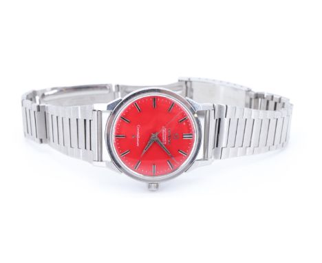 A 1960s Omega Constellation stainless steel automatic chronometer wristwatch, having a calibre 551 automatic movement and red