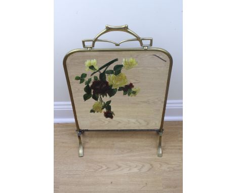A late 19th / early 20th Century brass framed floral-enamelled mirror-fronted fire screen, 73 cm high