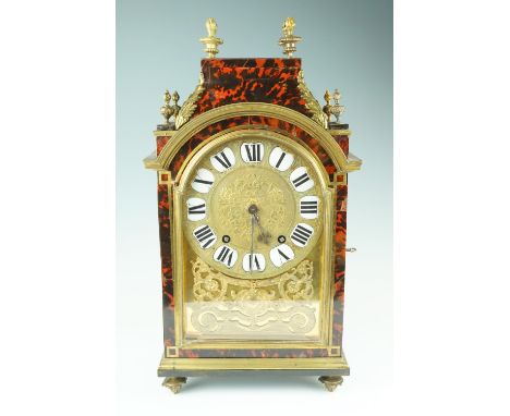 Marguerite, Paris, an early 19th Century brass mounted tortoiseshell veneered eight day bracket or mantle clock, the brass mo